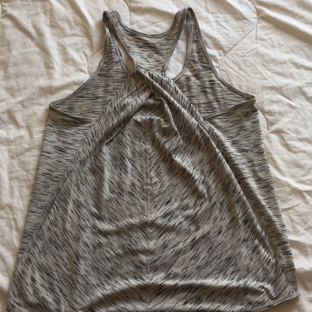Loose fit and comfy lulu tank with back detail!
